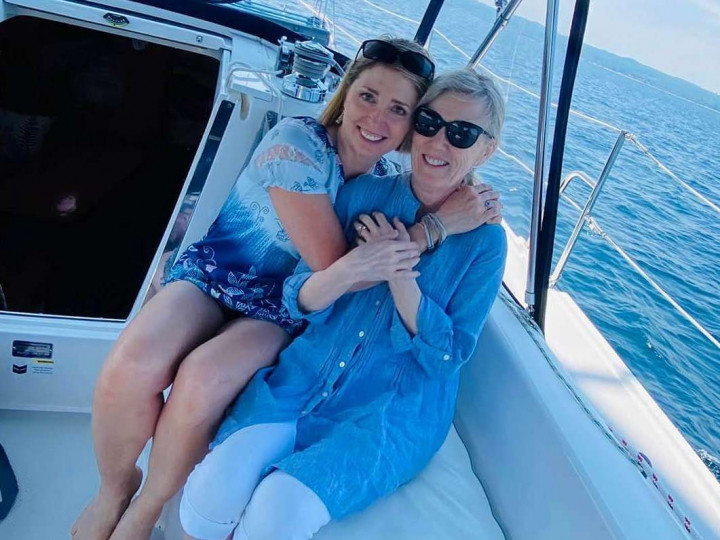 A family enjoying a sailing cruise.