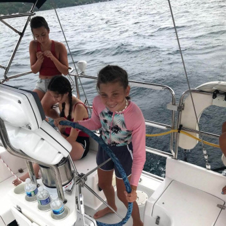 A family enjoying a sailing cruise.