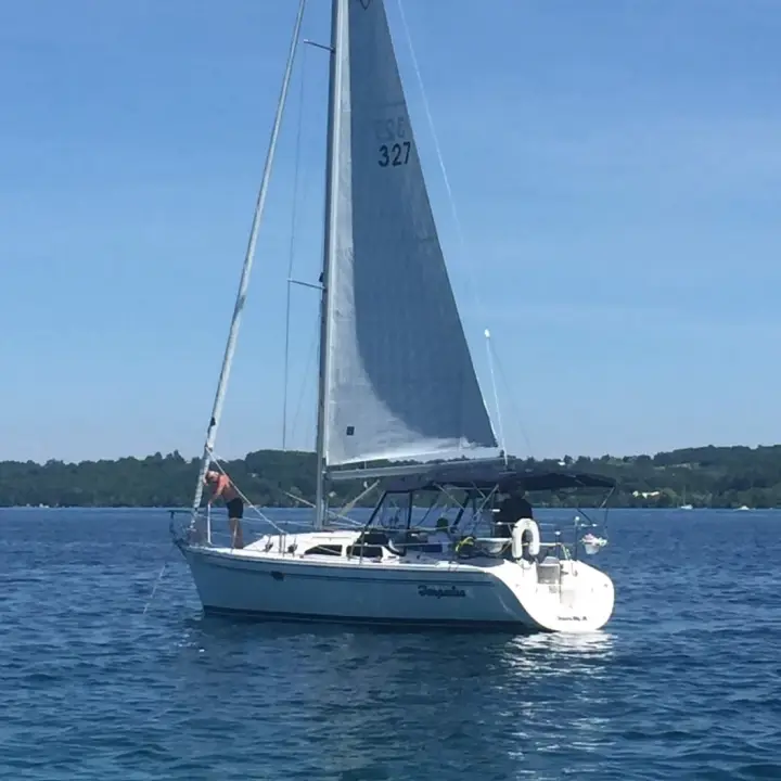 A family enjoying a sailing cruise.