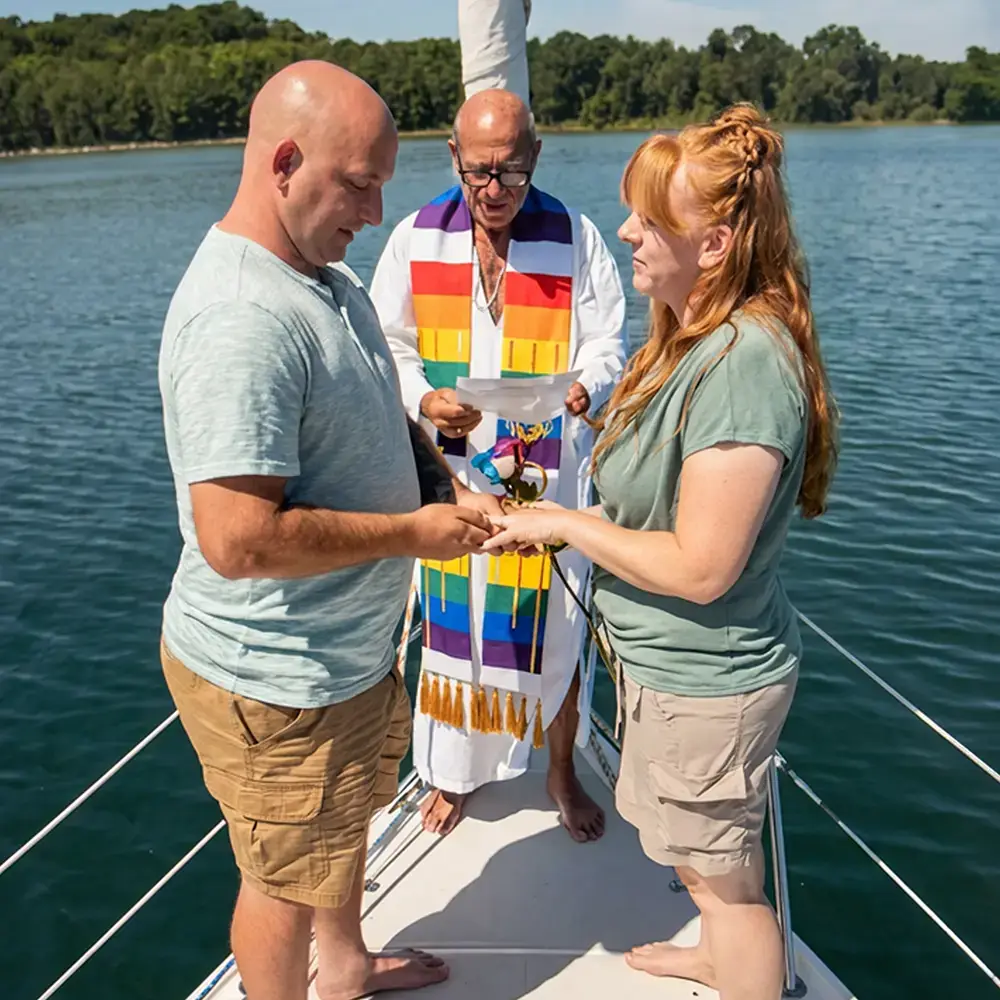Captain Ger officiates a wedding ceremony aboard the Impulse on Grand Traverse Bay