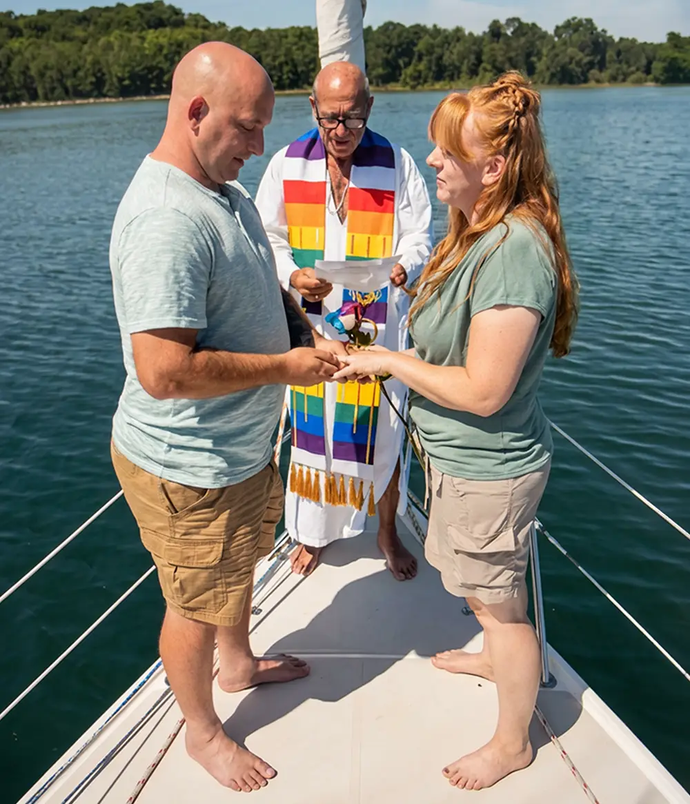 Clergy Captain Ger presides over a marriage ceremony aboard the Impulse on Grand Traverse Bay in Traverse City Michigan