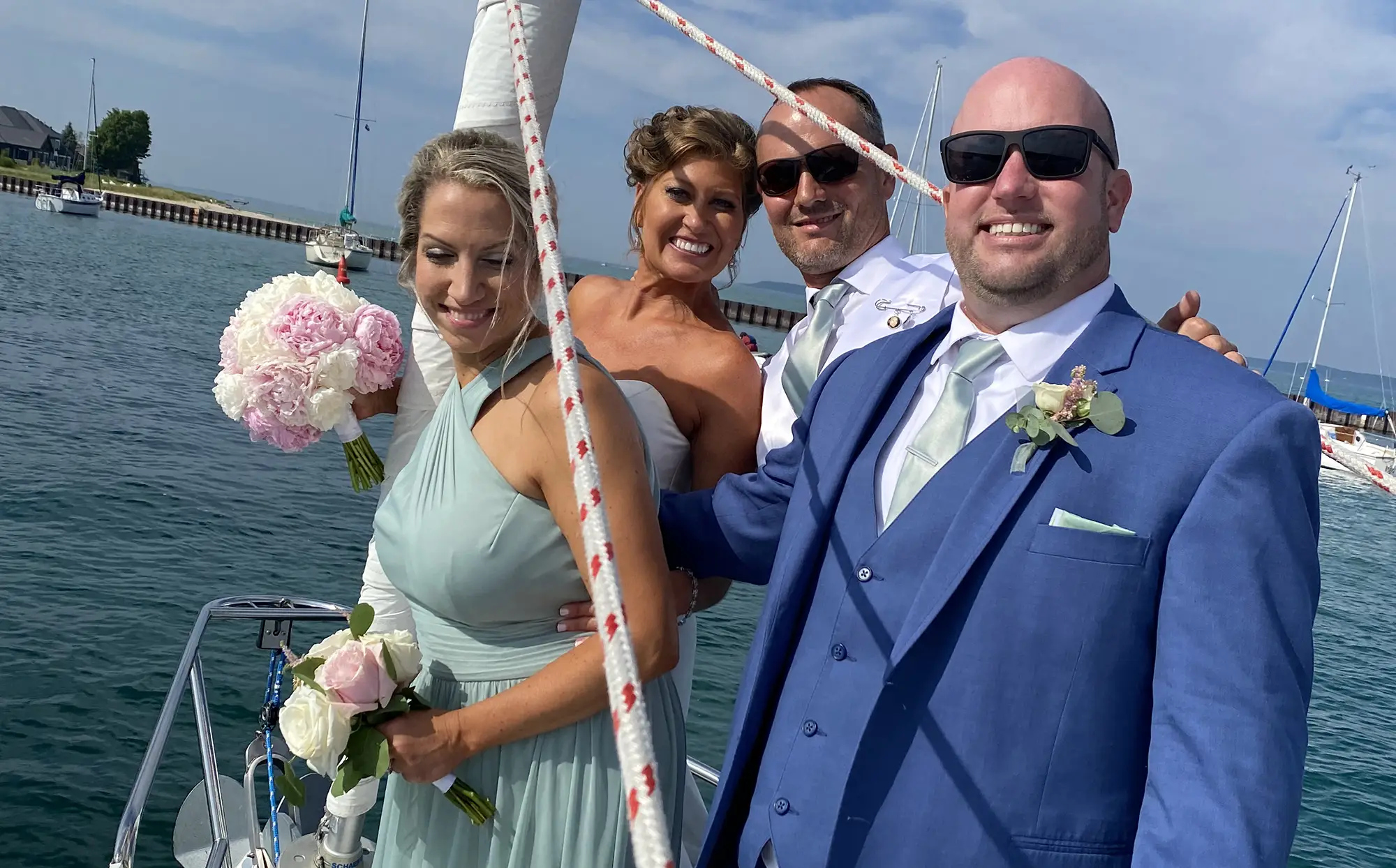 Members of a wedding party aboard the Impulse on Traverse City Bay in Traverse City Michigan